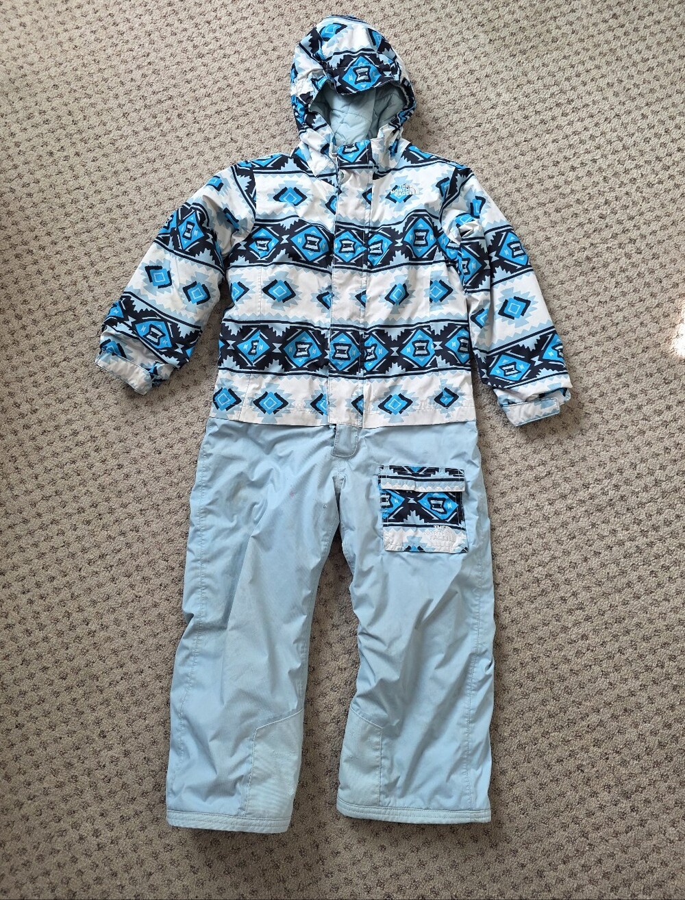 The North Face Kids One Piece Ski Suit in Light Blue and Turquoise Aztec Print